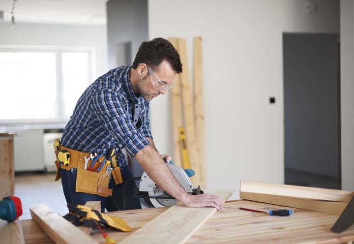 Carpenter working inside a new home | Business / Commercial Insurance
